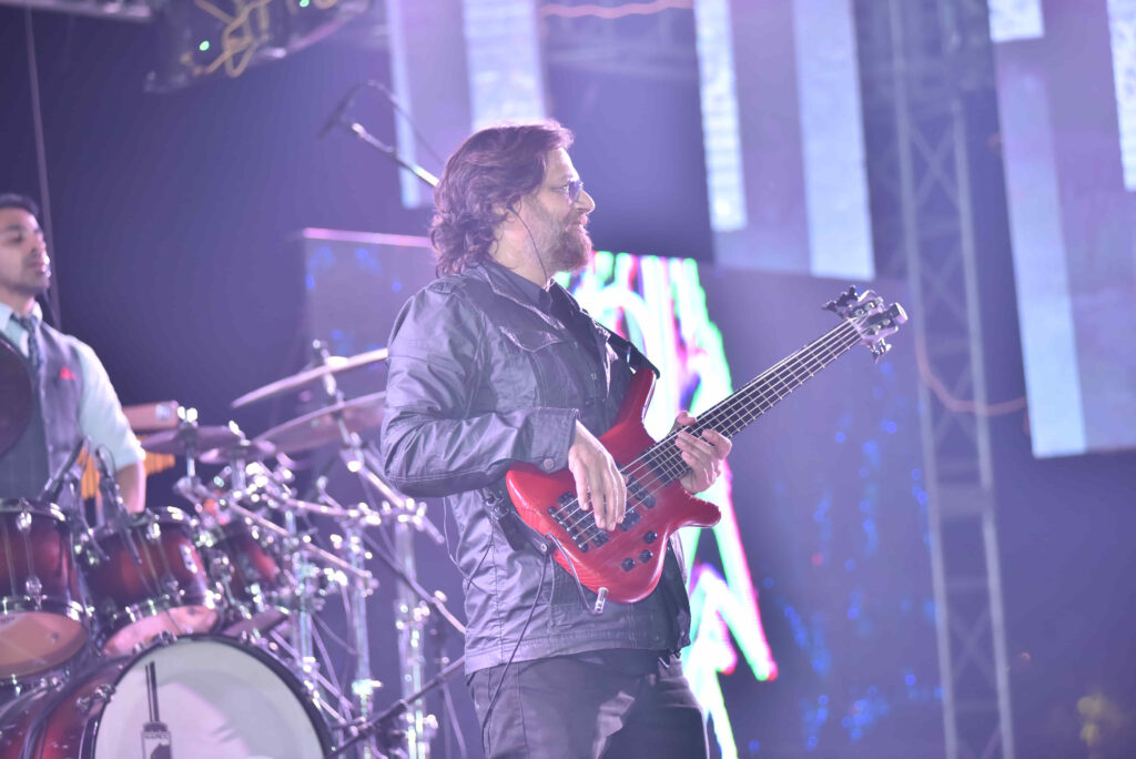 Bass guitarist performing at a Circle Club event