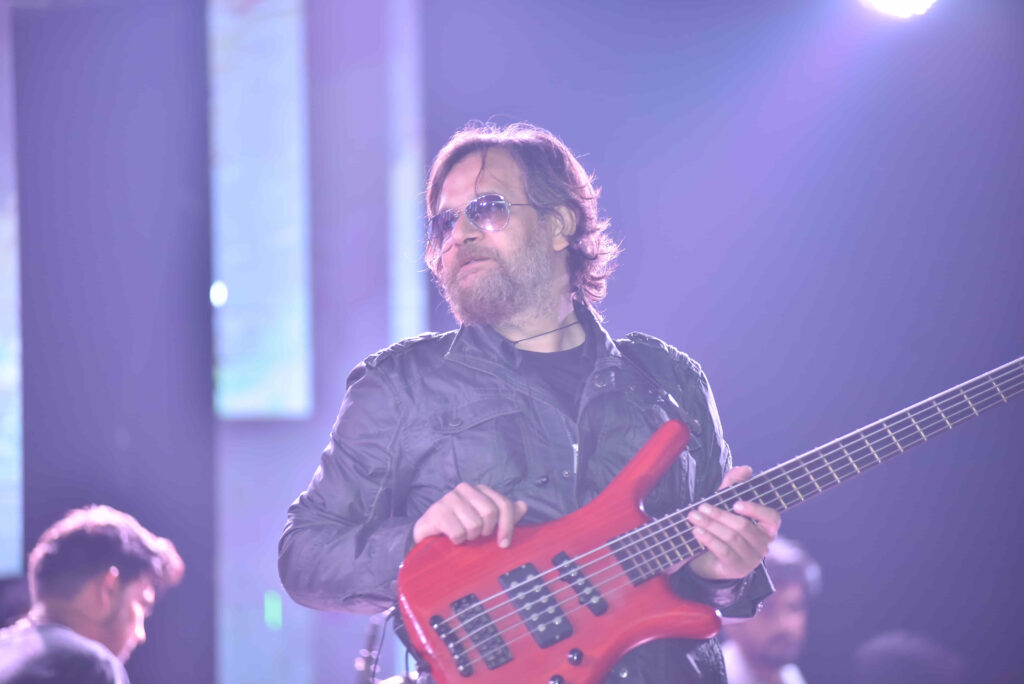 Bass guitarist on stage at a Circle Club event